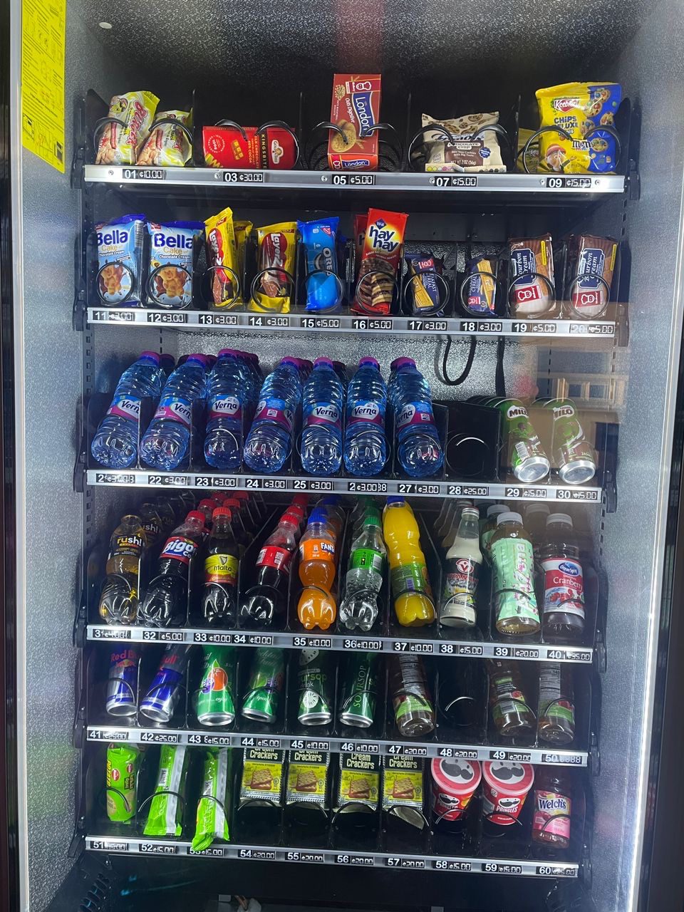 Shelves of snacks and drinks inside a Swaggers machine